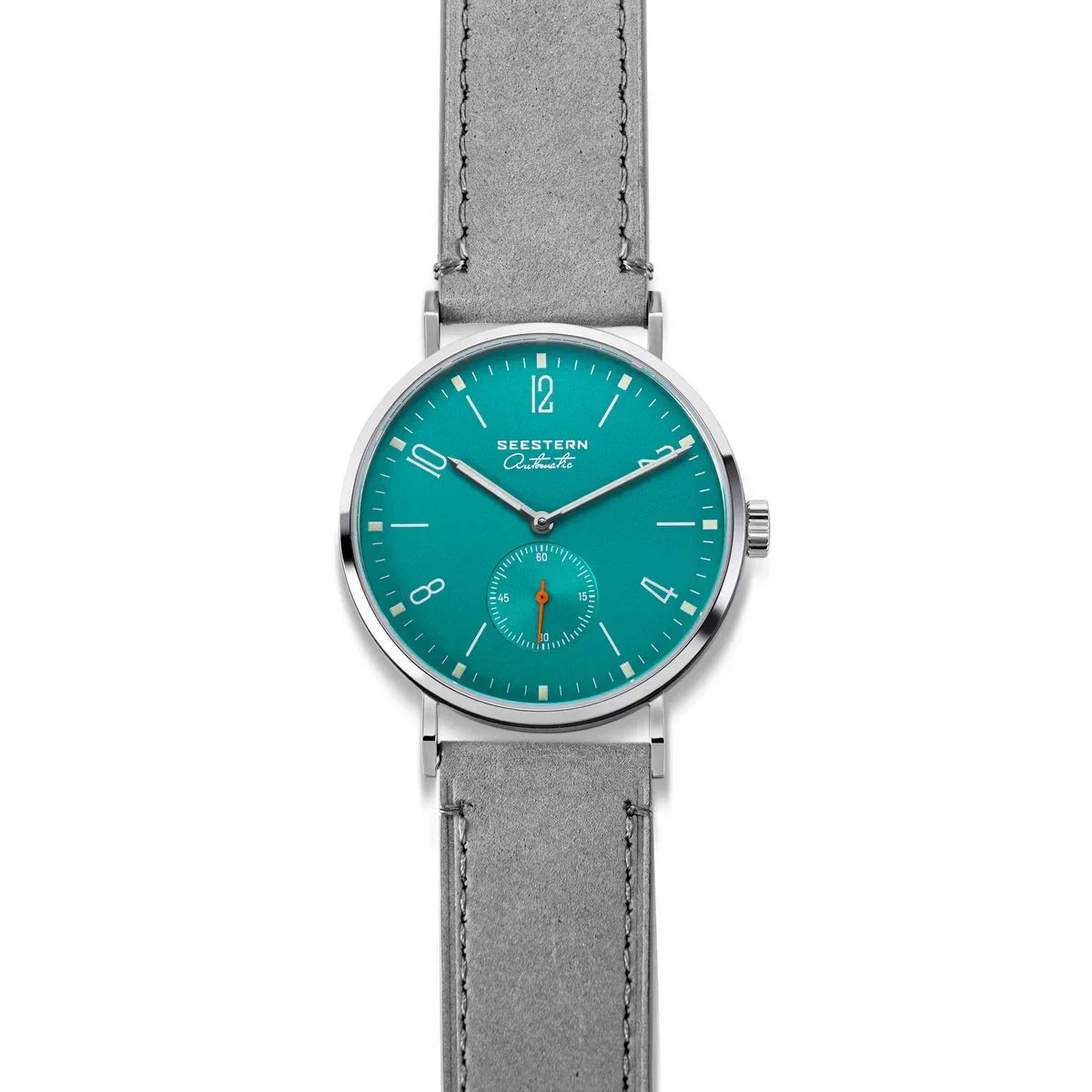 Seestern automatic watch with teal dial, silver case, and gray leather strap on white background