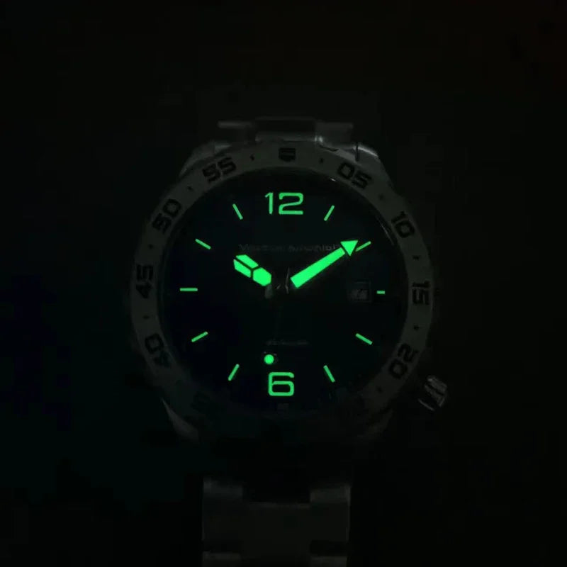Dark image of a wristwatch with glowing green luminous hands, 12 and 6 numerals, and hour markers